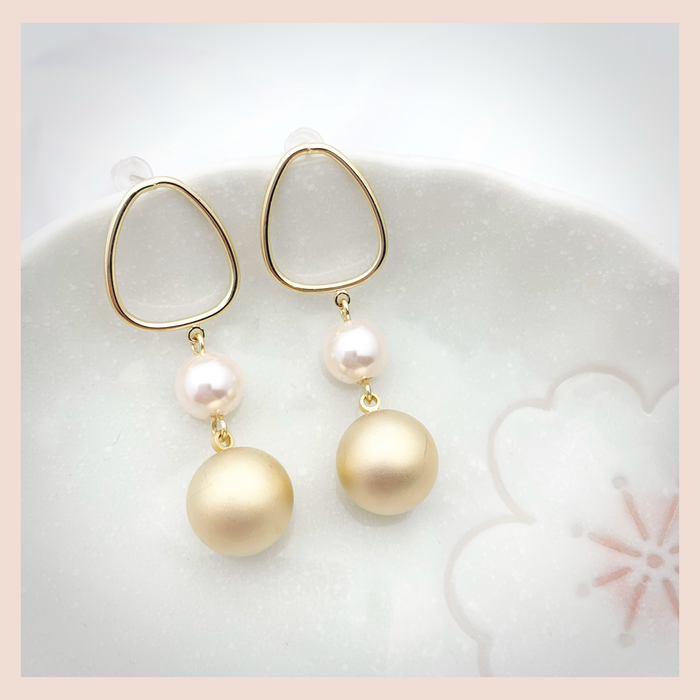 Matte gold pearl dangling earring